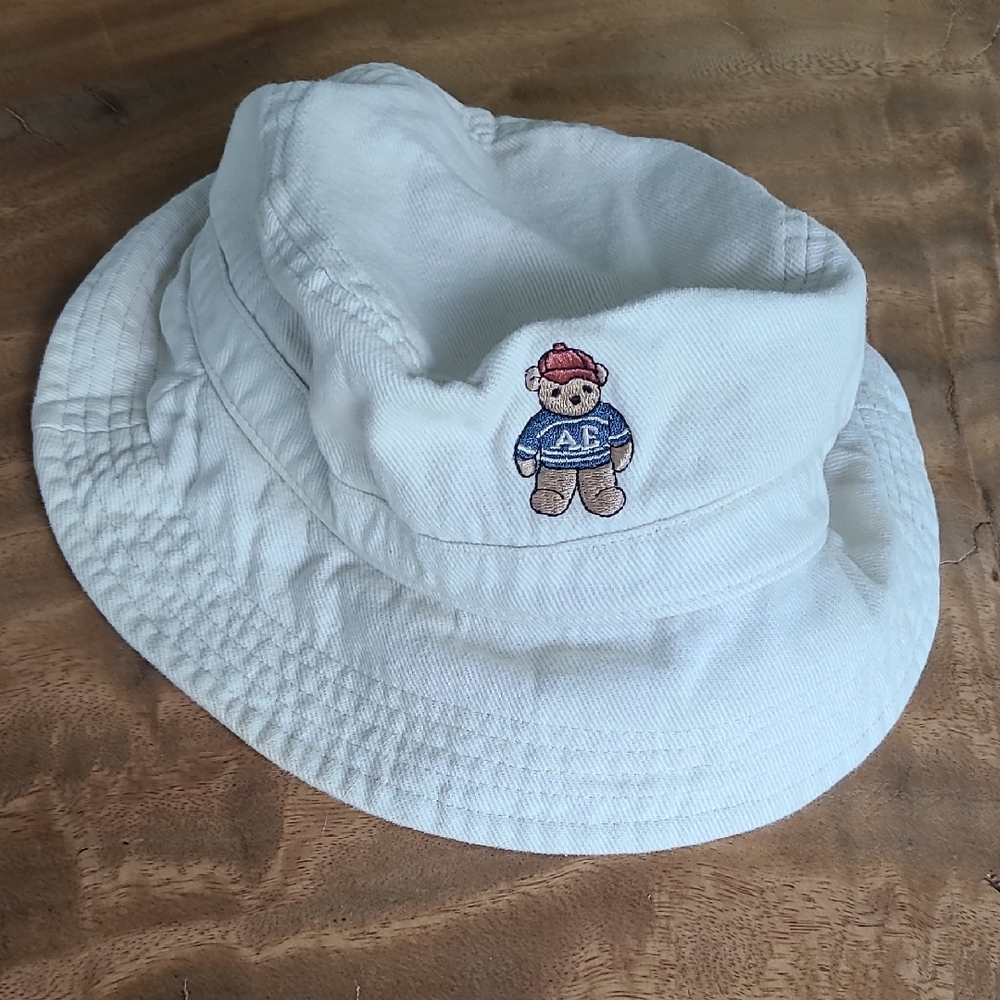 American Eagle Outfitters Cream Bucket Hat with Bear